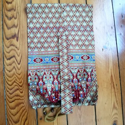 Sac tapis de yoga sol rouge plié